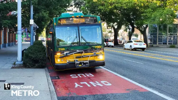 image of Route 106 in a bus only lane with King County Metro logo in corner