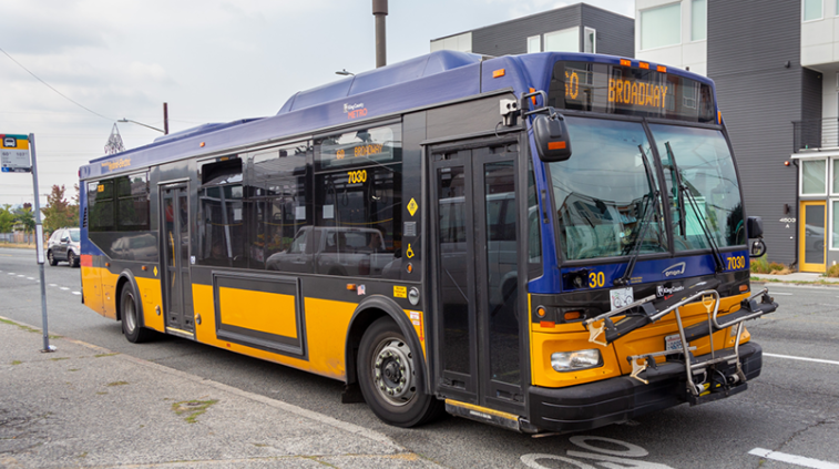 Image for a Route 60 bus pulling away from a bus stop 