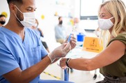 Vaccine male nurse female patient