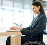 Woman laptop wheelchair