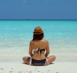 woman sitting on beach