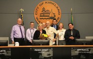 Photo of Mayor Penny Sweet and the Kirkland City Councilmembers with Rep. Larry Springer at council meeting