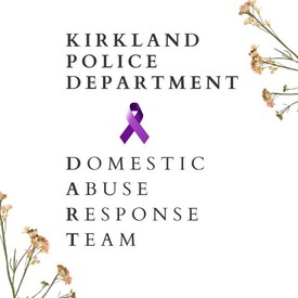 A purple ribbon with text: Kirkland Police Department Domestic Abuse Response Team