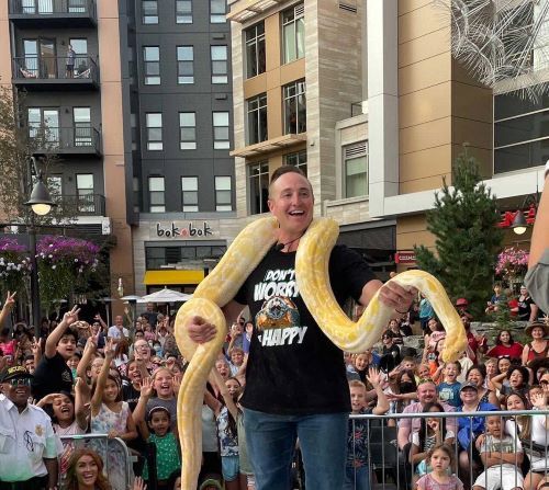 village at totem lake corbin maxey holding snake