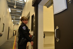 corrections officer opening cell