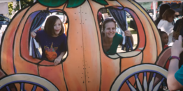 parent and child taking a picture at the Harvest Festival