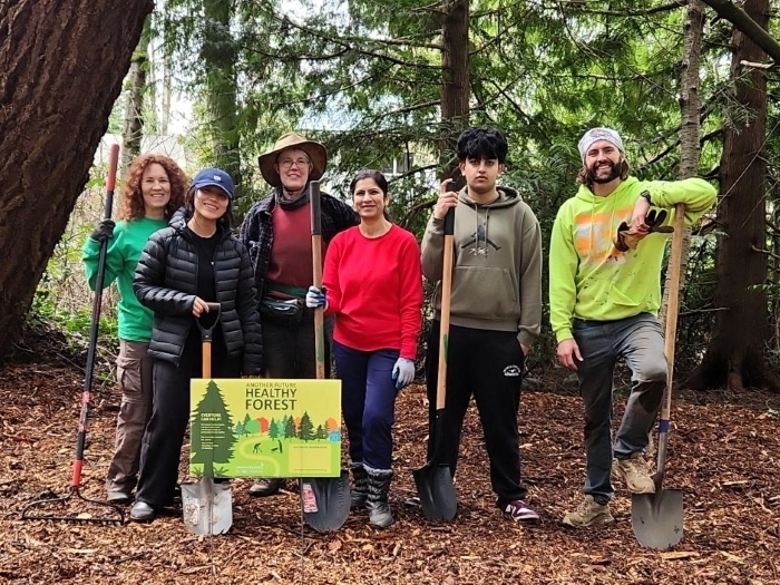 Green Kirkland Stewards pose together during an event