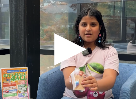 Video thumbnail shows Children's Business Fair participant Aria with a play symbol