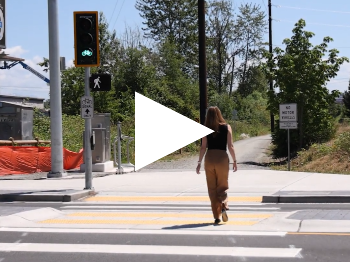 Thumbnail shows a woman using the crossing at Slater, the final connection of the CKC