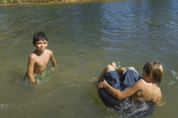 children playing in a lake