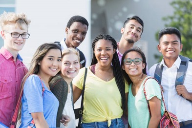Multicultural group of youth smiling