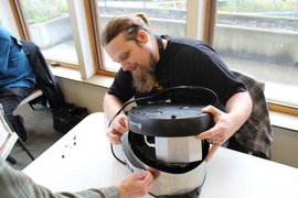 Volunteer fixing a crockpot.