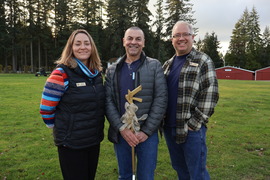 Award recipient holding a golden litter picker.