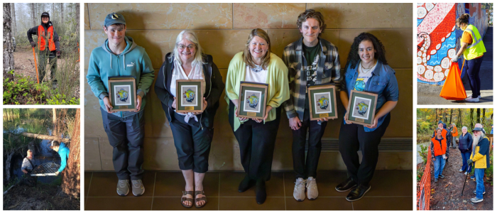 Earth day award recipients holding up their award