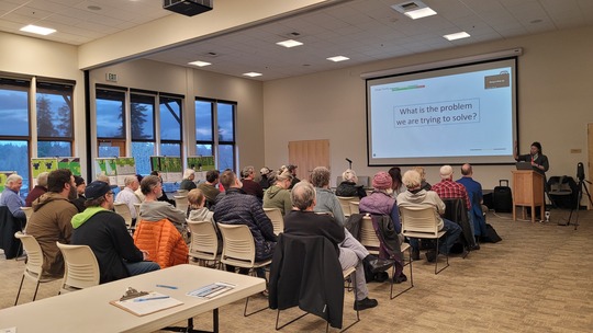 room full of attendees viewing a presentation