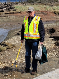 James Heytvelt picking up litter in the Harper restoration.