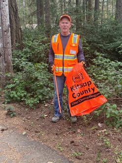 Jerry King with litter cleanup bag and picker.