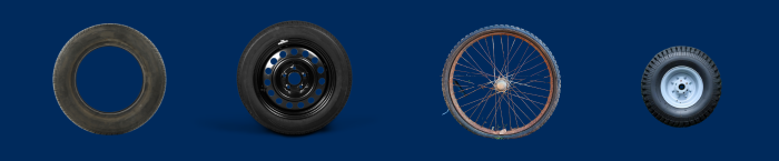 A collage of tires that we'll accept: a passenger vehicle tire without rims, a passenger vehicle tire with rims, a bike tire, and a wheelbarrow tire