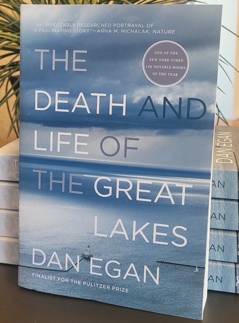 photo of dan egan book with stack behind