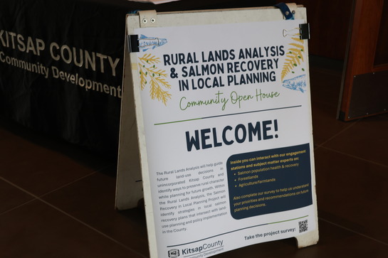 sandwich board greeting people