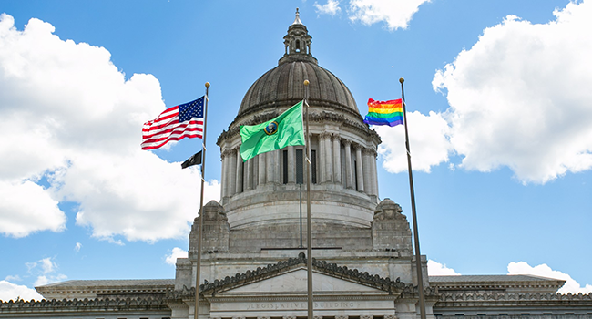 pride flag flying over the capitol