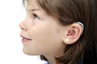 girl with hearing aid