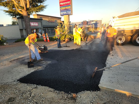 Crews pave driveways near 44th Ave W and 196th St SW