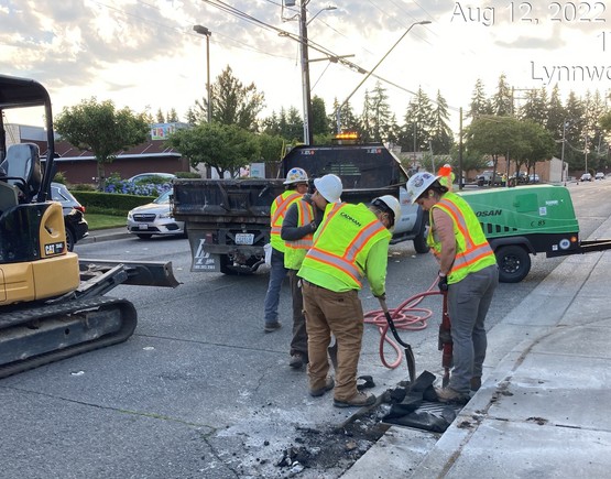 Preparing surface for pavement grinding along 176th St SW