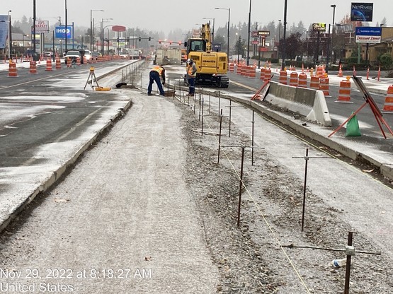 Crews prepare the center of 196th St SW for the installation of a new concrete median