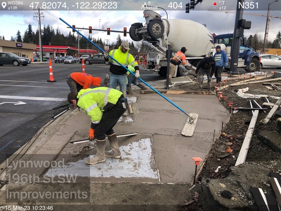 Crews pave sidewalks at 196th St SW and 44th Ave W 
