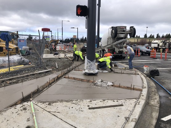 Crews pave sidewalks at 196th St SW and 44th Ave W 