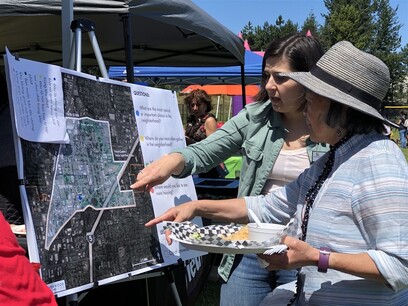 A community member and planning commission member reviewing a map of lynnwood