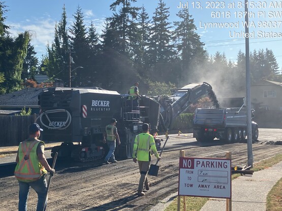 Asphalt grinding (milling) to prepare street for new surface.