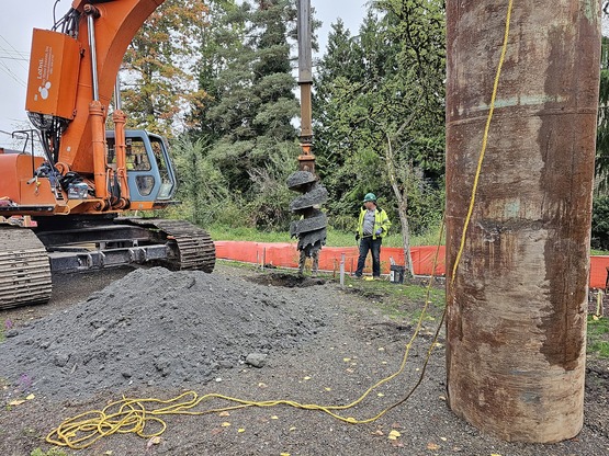 Drilling for light pole foundations along the trail.