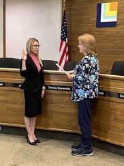 Derica taking the oath of office