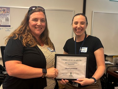 Marcie MacQuarrie accepting the Most Innovative Solution Award from Snohomish County PUD