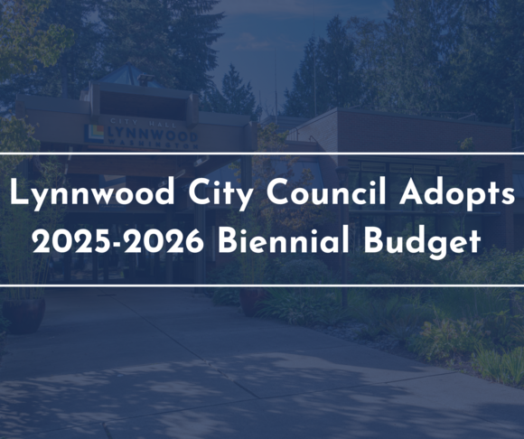 A transparent blue box overlaying a photo of City Hall with the words "Lynnwood City Council Adopts 2025-2026 Biennial Budget "