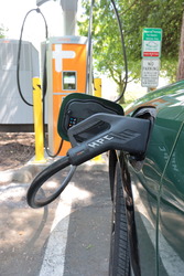 A charger plugged into the first EV