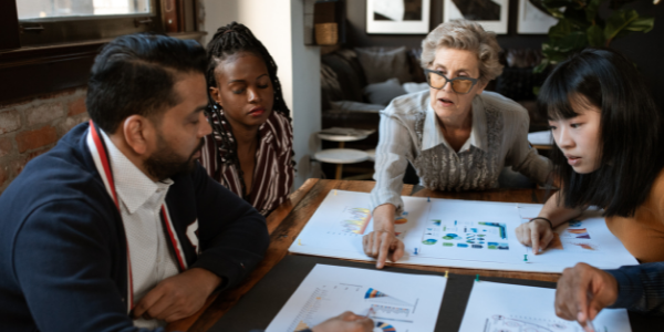 Group of people around a table having a meeting