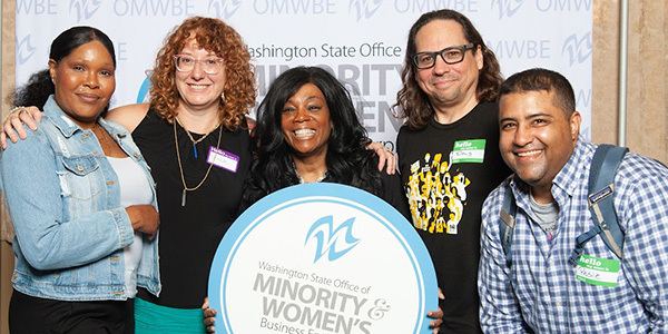 five supplier diversity team members pictured at OMWBE 40th anniversary in 2023