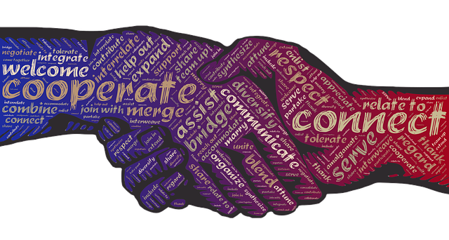 Shadow of two hands shaking