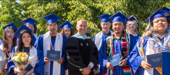 Students from Innovation Heights wearing blue graduation gowns