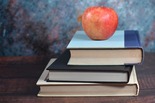 apple on stack of books