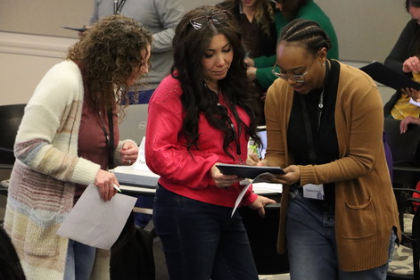 Task force members share notes during a networking activity at the March 2025 meeting of the FutureReady Task Force.