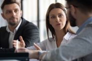 Woman talking with two men