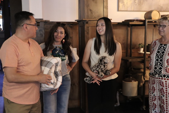 Student Board member Abby Wu (left) smiles while Board Chair Mary Fertakis thanks her for your service.
