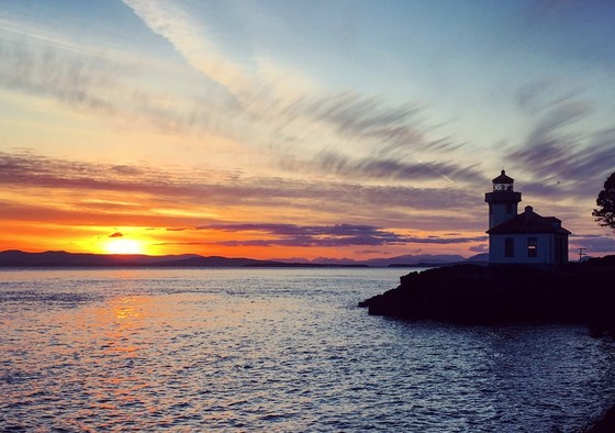 Sunset behind a lighthouse