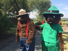 Smokey and Bagley, a bear and a beaver, the US Forest Service and State Parks mascots stand together.