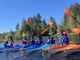 paddle safe course participants on the water demonstrating kayak safety practices