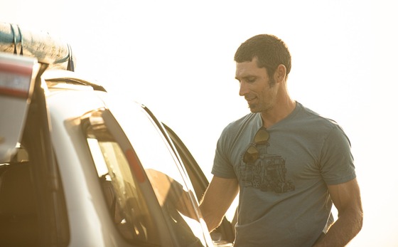 2024 free days man opens car door in sunlight